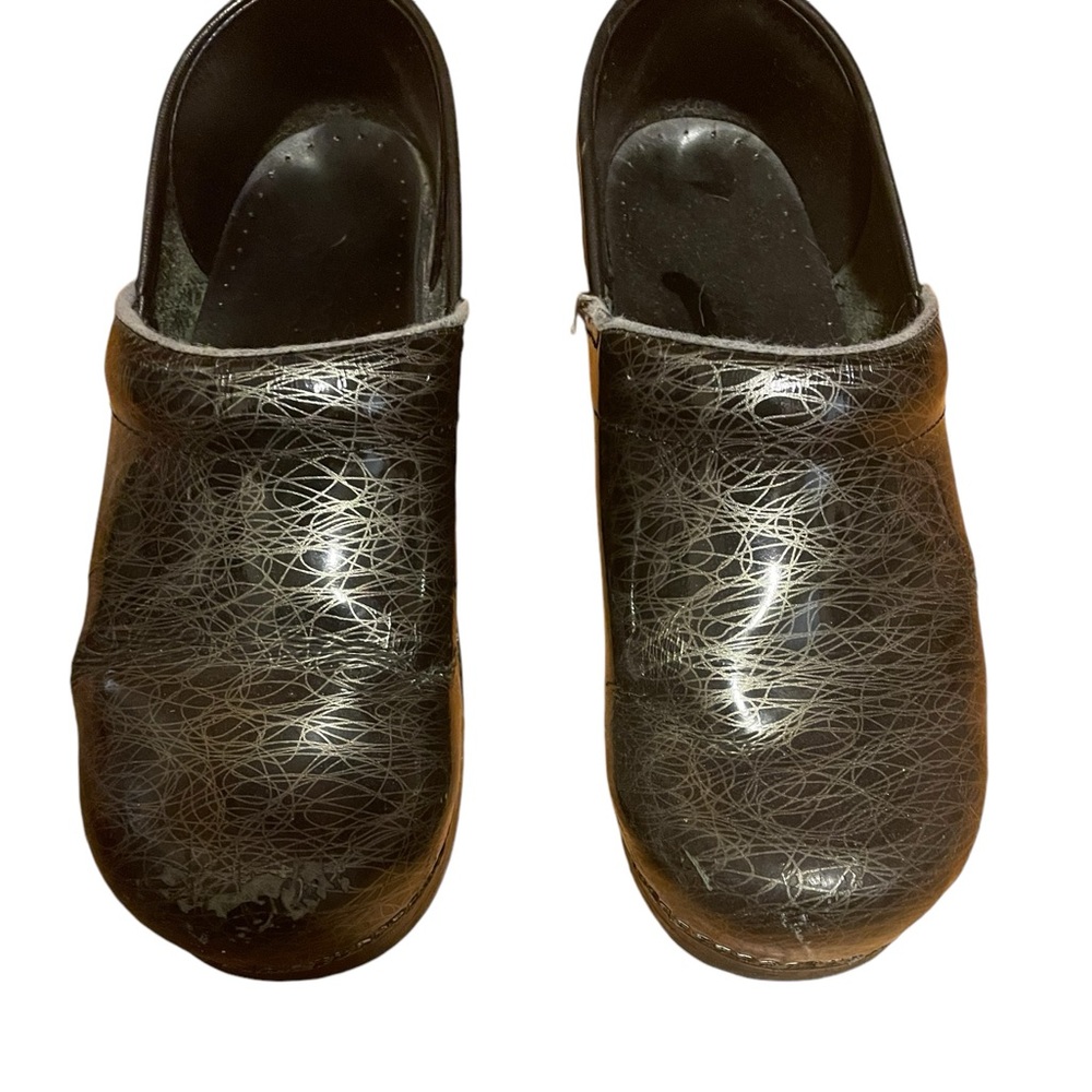 Used- lots of life left in these Dansko silver & black clogs.